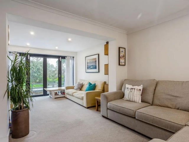This house comes with four bedrooms, two reception rooms and two bathrooms as well as a large garden and driveway.