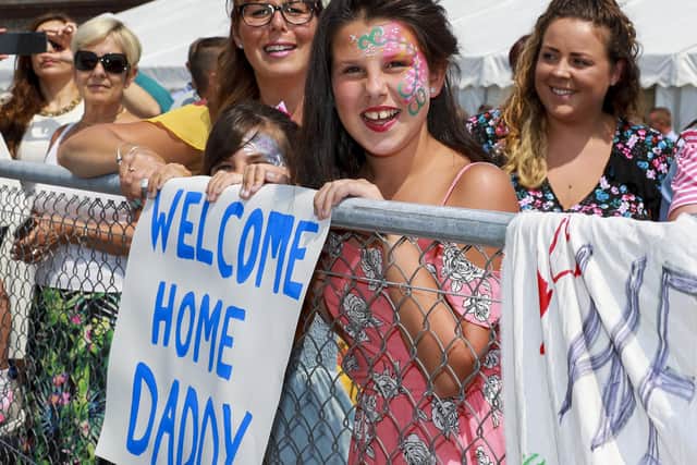Isabel Collins and her mum Emma Collins welcome back their dad