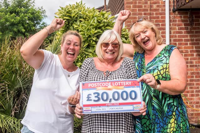 Lynn Kimber (centre), of Lancaster Close, Portchester, alongside her friends Clare (L) and Pat (R) after winning £30,000 in the People's Postcode Lottery.