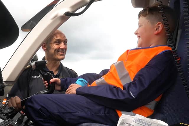 Henry Russell, 9, on a National Grid helicopter.