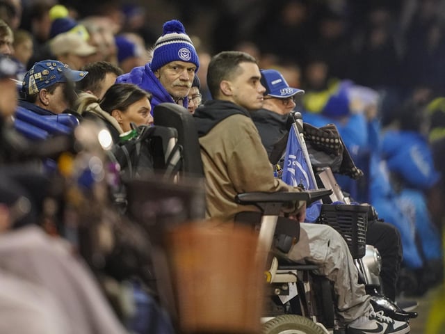 Pompey fans backed their team to a crucial Championship survival win over Cardiff last night.