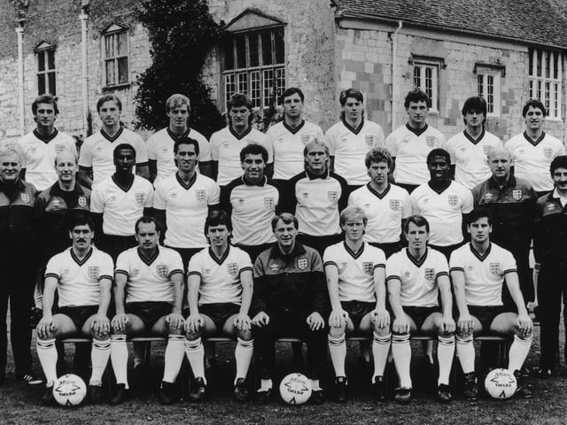 Mark Hateley takes his place in the 1986 England World Cup squad. Front (from left): Kenny Sansom, Ray Wilkins, Bryan Robson, Bobby Robson, Mark Wright, Trevor Steven, Paul Bracewell. Middle: Dr. Vernon Edwards, Fred Street, Viv Anderson, Mark Hateley, Peter Shilton, Gary Bailey, Tony Woodcock, John Barnes, Don Howe, Norman Medhurst. Back: Trevor Francis, Gary Stevens, Kerry Dixon, Glenn Hoddle, Alvin Martin, Chris Waddle, Dave Watson, Terry Fenwick, Gary Lineker. Picture: Hulton Archive/Getty Images