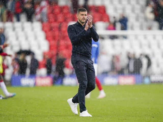 Head coach John Mousinho shows his appreciation for the travelling Fratton faithful following the full-time whistle