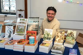 Matt Wingett with his Portsmouth related publications. Picture: Mike Cooter (111222)
