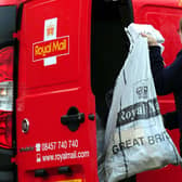 A general view of a Royal Mail worker collecting post. Picture: Rui Vieira/PA Wire
