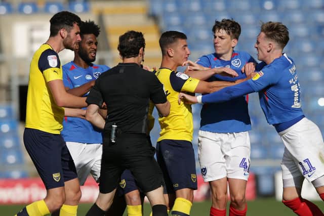 Tempers flare between Cameron Brannagan and Ronan Curtis during last season's play-off semi-final second leg at the Kassam Stadium.  Picture: Robin Jones/Getty Images