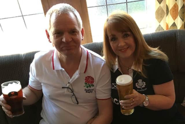 David and Lorna Eves pictured wearing England and Scotland shirts as they watched a rugby match - in a Welsh pub. They;ll both be watching the England v Scotland Euros clash on Friday evening,