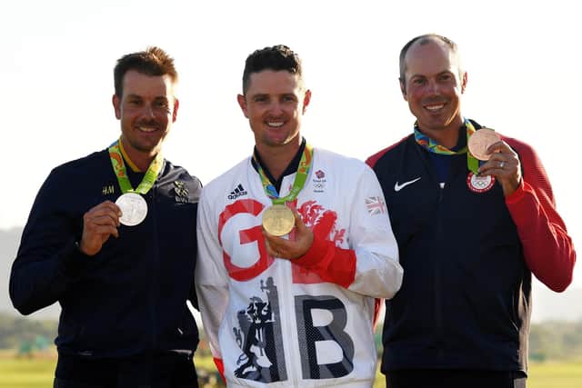 Justin Rose celebrates with the 2016 Olympic gold medal flanked by silver medallist Henrik Stenson (left) and third-placed Matt Kuchar. Photo by Ross Kinnaird/Getty Images.