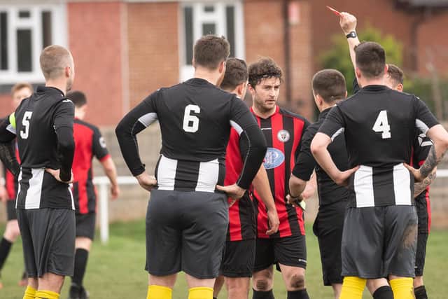 Jon Stevens is shown a red card as Locks Heath's afternoon goes from bad to worse against Hayling. Picture: Keith Woodland