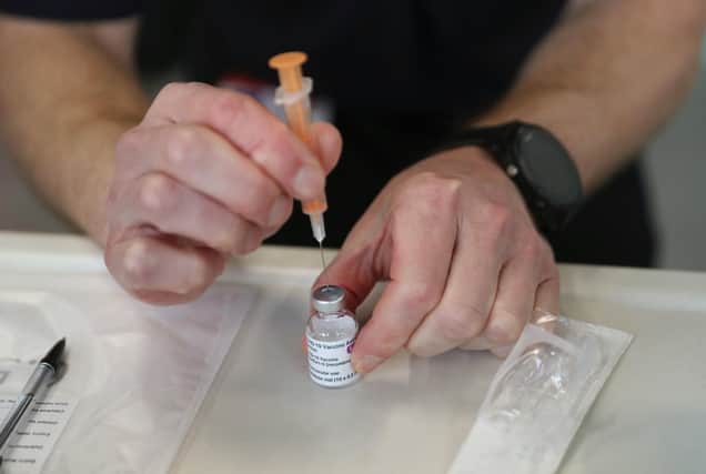 A dose of the Oxford/AstraZeneca coronavirus vaccine is prepared by a member of the Hampshire Fire and Rescue Service at Basingstoke fire station, which has been set up as a vaccination centre and where crews are still answering 999 calls on February 4, 2021 in Basingstoke, England. (Photo by Andrew Matthews - WPA Pool/Getty Images)