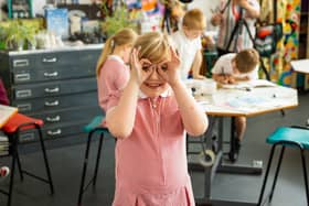 A pupil enjoying their art class