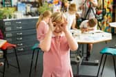 A pupil enjoying their art class