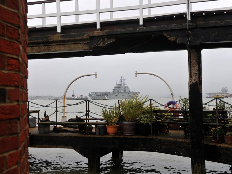 The ITS Giuseppe Garibaldi heading into Portsmouth - with HMS Queen Elizabeth spotted in the background