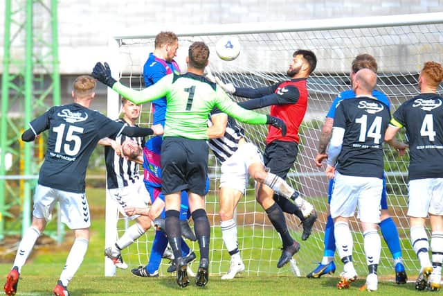 Andrew Todd rises highest to set up US Portsmouth's injury-time leveller against Bemerton. Picture: Martyn White.