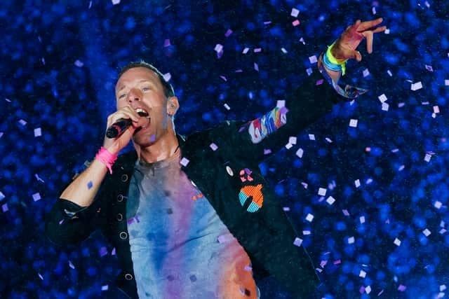 Chris Martin from Coldplay. The British rock band are set to headline Glastonbury Festival on Saturday night, but will the weather hold out for fans attending the festival? (Credit: Getty Images)