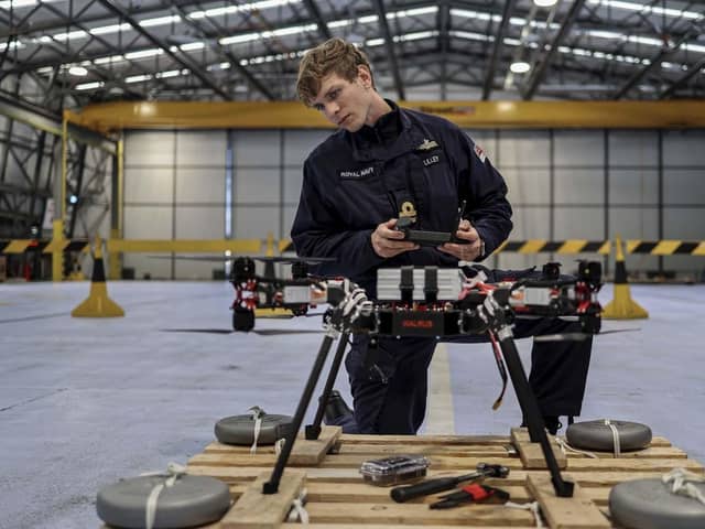 Sailors from 700X Naval Air Station have designed, built and tested their own drone. The large quadcopter called Walrus will be used a testing platform for sensors and other payloads. Pictured with the Walrus is Lieutenant Kristian Lilley.