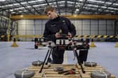 Sailors from 700X Naval Air Station have designed, built and tested their own drone. The large quadcopter called Walrus will be used a testing platform for sensors and other payloads. Pictured with the Walrus is Lieutenant Kristian Lilley.
