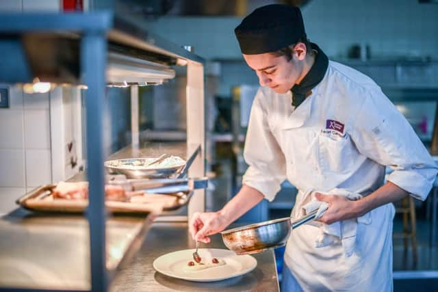 A catering student at work. 