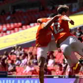 LONDON, ENGLAND - MAY 30: Kenny Dougall of Blackpool celebrates with Keshi Anderson after scoring their side's first goal during the Sky Bet League One Play-off Final match between Blackpool and Lincoln City at Wembley Stadium on May 30, 2021 in London, England. (Photo by Catherine Ivill/Getty Images)
