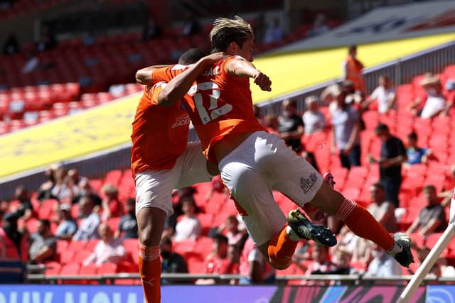 LONDON, ENGLAND - MAY 30: Kenny Dougall of Blackpool celebrates with Keshi Anderson after scoring their side's first goal during the Sky Bet League One Play-off Final match between Blackpool and Lincoln City at Wembley Stadium on May 30, 2021 in London, England. (Photo by Catherine Ivill/Getty Images)