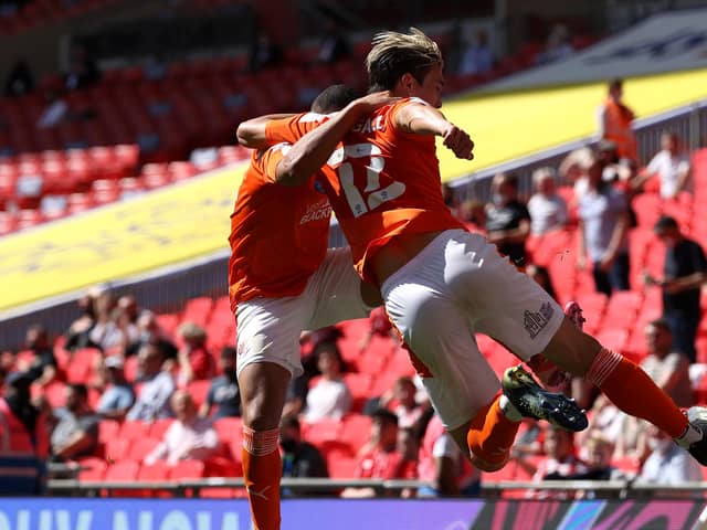 LONDON, ENGLAND - MAY 30: Kenny Dougall of Blackpool celebrates with Keshi Anderson after scoring their side's first goal during the Sky Bet League One Play-off Final match between Blackpool and Lincoln City at Wembley Stadium on May 30, 2021 in London, England. (Photo by Catherine Ivill/Getty Images)