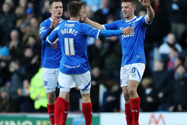Tom Craddock is congratulated by Jed Wallace and Ricky Holmes after scoring against Scunthorpe in November 2013. Picture: Joe Pepler