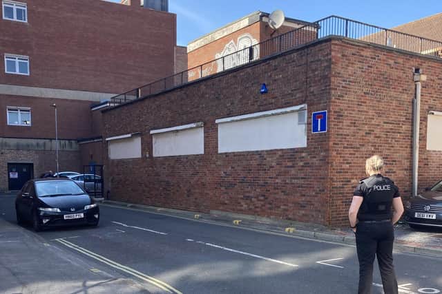 Police investigate as objects thrown off abandoned Debenhams store in Commercial Road on April 17. Pic Steve Deeks