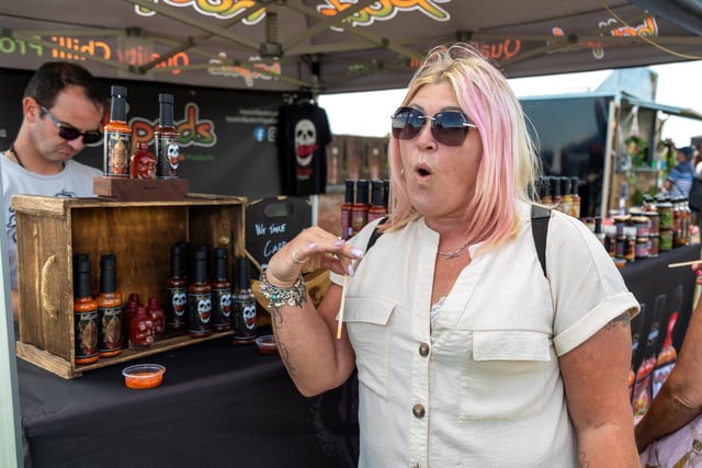 Sandy Sykes from Eastleigh has second thoughts after trying the End Game super hot sauce from Woking based Hot Pods. Picture: Mike Cooter (210522)