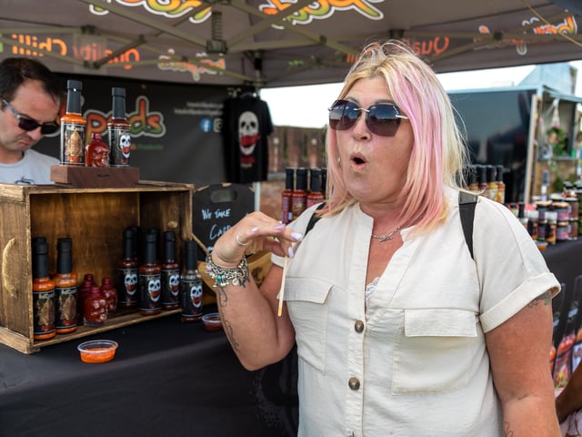 Sandy Sykes from Eastleigh has second thoughts after trying the End Game super hot sauce from Woking based Hot Pods. Picture: Mike Cooter (210522)
