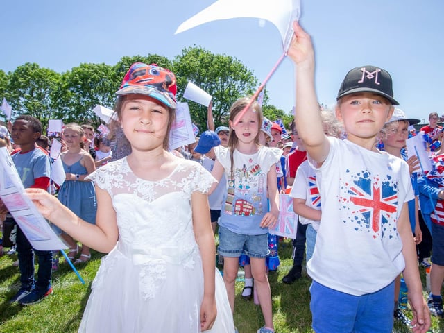 Pupils of Horndean Infant School, Horndean singing the national anthem