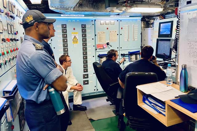 A Fijian Sea Rider observes in HMS Spey's control room