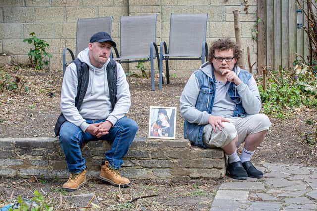 Sonny and Harry Shaw with a picture of their mother, Dee. Picture: Habibur Rahman