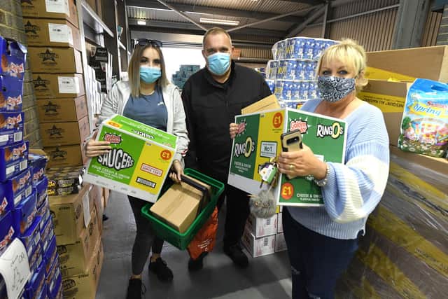 Pictured L-R Summer Jurd, 14, with parents Phil Jurd, 46, and Lisa Jurd, 52, with their purchases. 
Picture by Paul Jacobs/pictureexclusive.com