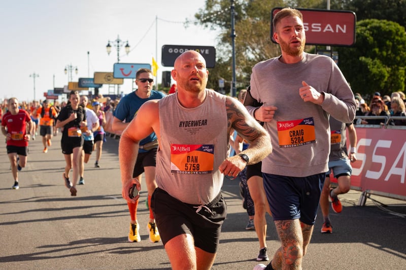 Pictured is: Runners cross the line to finish