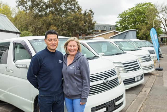 John and Emma Ward in front of their fleet of converted campervans at Sugoi Campers in Fareham. Pictured: John Ward, Emma Ward. Picture: Mike Cooter (130521)