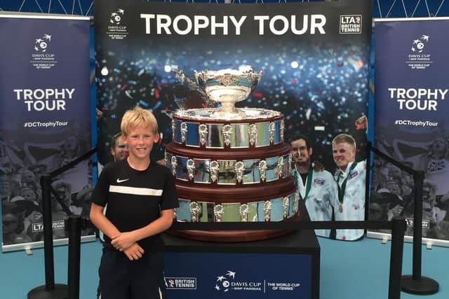 The family of Lewis Taylor, 15, have set up a fundraiser so he can stay out at his tennis school in Florida after his parents had to close their pub due to Covid-19. Pictured: Lewis with the Davis Cup
