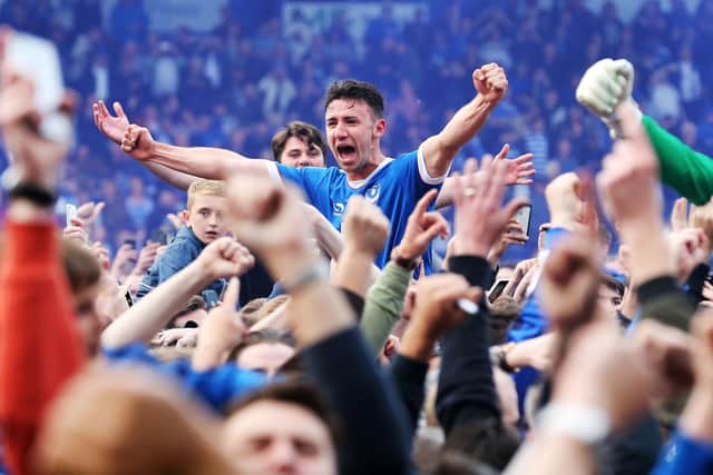 Enda Stevens celebrates Pompey's League Two title win in 2017 with the fans on the pitch at Fratton Park  Pictiure: Joe Pepler/Digital South.