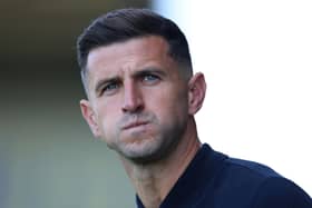 OXFORD, ENGLAND - AUGUST 09:  John Mousinho, Manager of Portsmouth, looks on before the Sky Bet Championship match between Oxford United and Portsmouth at Kassam Stadium on August 09, 2025 in Oxford, England. (Photo by Dan Istitene/Getty Images)