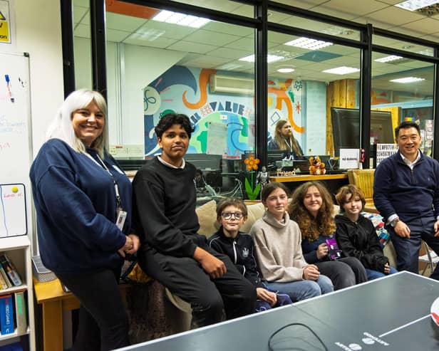 Alan Mak MP at WAVE's hub on Hayling with manager Sarah Foley and young people from the Island