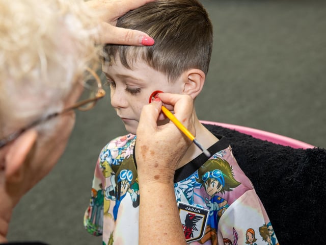 Teddy, 7, from Portsmouth, getting his face painted.  Photos by Alex Shute