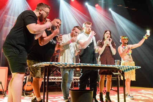 Pictured is: The sausage eating contest.
Picture: Keith Woodland (100921-36)