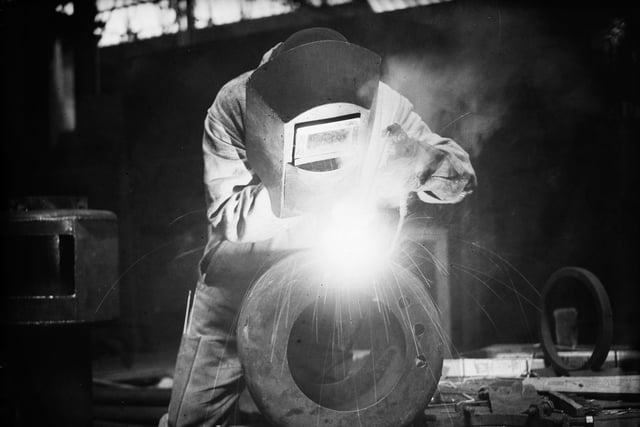 July 1939:  A welder at work on the refitting of a ship at Portsmouth dock.  (Photo by General Photographic Agency/Getty Images)