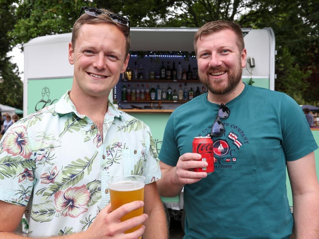 Nathan Davies and Mike Hardy enjoying refreshment at the Denmead Village Show. Picture: Chris Moorhouse (160825-34)