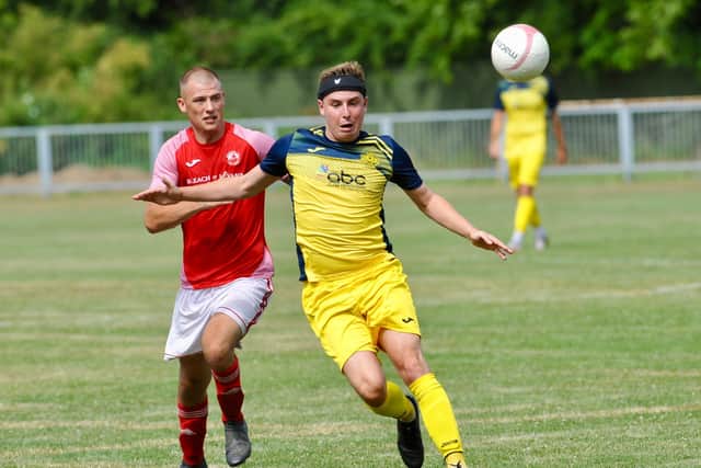 Moneyfields defender Tom Cain, right, during the 8-0 friendly win at Arundel. Picture by Steven Goodger.