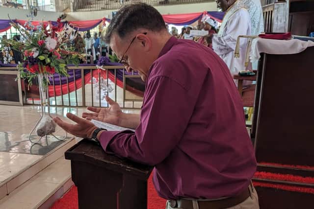 Bishop Jonathan Frost prays