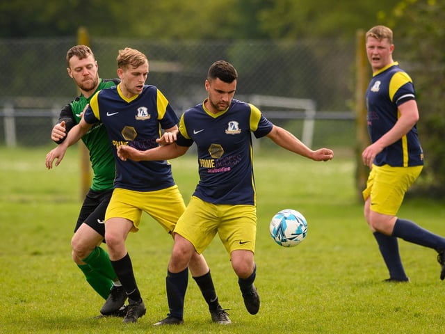 Action from Saturn Royale's 1-0 win over Pelham Arms (blue and yellow kit) in the second Adelaide Cup semi-final. Picture: Keith Woodland (300421-437)