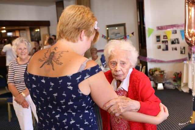 Charlie Elkins dancing with great-grandmother Marge Dunaway on her 100th birthday