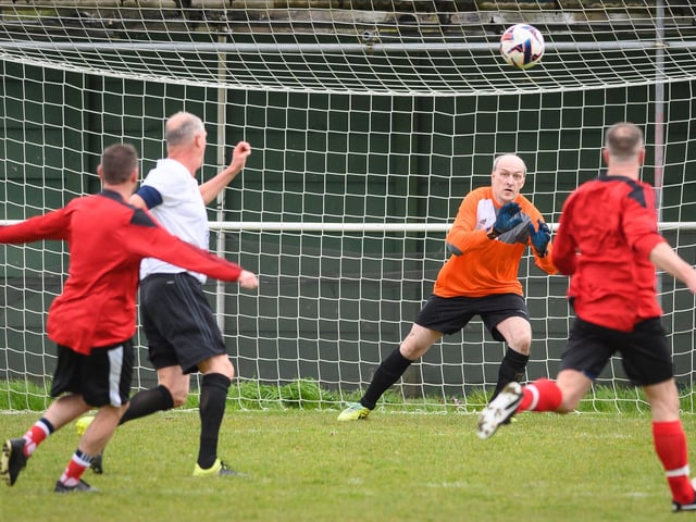 Action from the Jon Gittens memorial charity match between a team of former Fareham Town players and a side of ex-Pompey and Southampton professionals. Picture: Keith Woodland (160421-368)