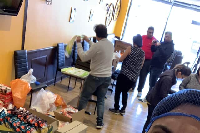 Portsmouth student, Jigar Patel, along with other volunteers preparing meal parcels for NHS staff.