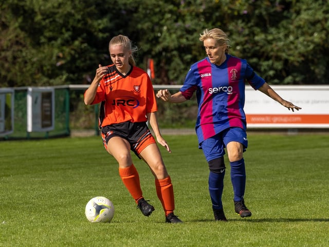 Portchester's Charlotte Alner and USP's Joanne Oliver. Picture: Mike Cooter